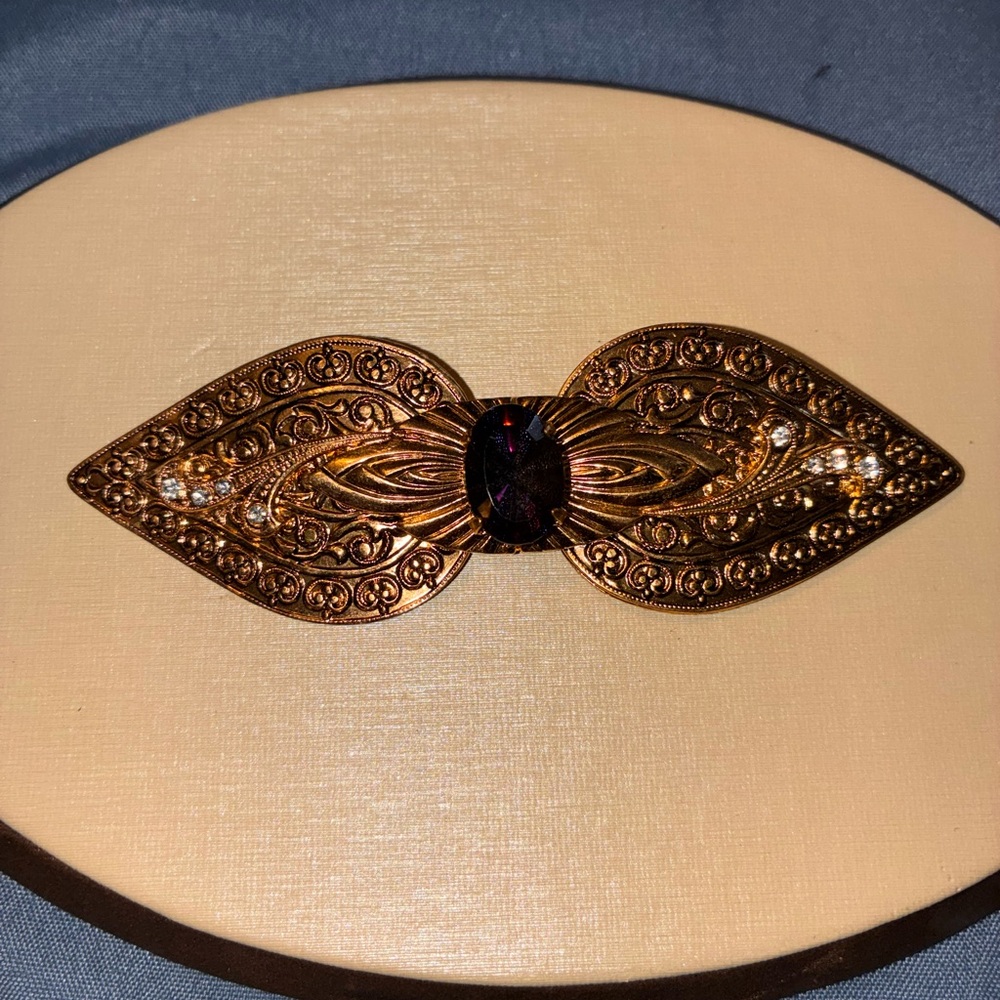 Ornate Gold Brooch with Gemstone Accent